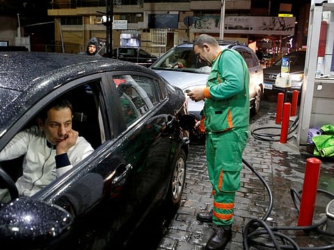 A worker fills up a car's tank at a petrol station, in Beirut, Lebanon, November 27, 2019.