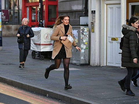 People are evacuated from London Bridge in central London following a police incident, Friday, Nov. 29, 2019. 