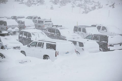 This Tuesday, November 27, 2019 photo provided by the Mammoth Mountain Ski Area shows parked SUVs covered in snow at Mammoth Mountain in Mammoth Mountain, Calif. Blizzard conditions have closed Interstate 5 south of Ashland, Oregon, all the way to the California state line. The Siskiyou Summit at the border on I-5, typically one of the more perilous sections of freeway along the West Coast corridor in wintery weather, had seen 6 inches of new snow with 10 inches packed on the roadside. 