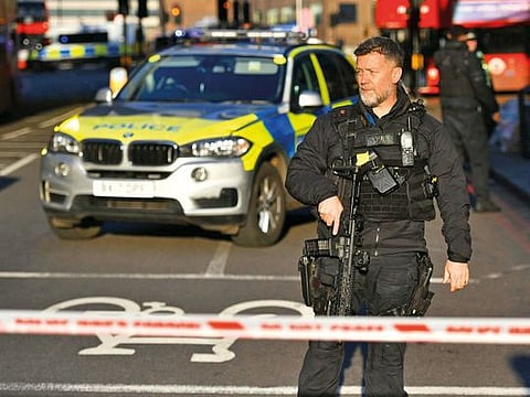 Police at the scene of an incident on London Bridge in central London following a police incident, Friday, Nov. 29, 2019. British police said Friday they were dealing with an incident on London Bridge, and witnesses have reported hearing gunshots.  The Metropolitan Police force tweeted that officers were ‚Äúin the early stages of dealing with an incident at London Bridge.