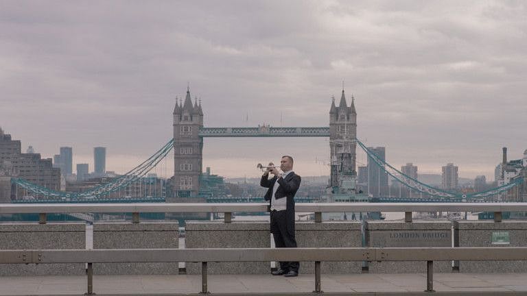 Expo 2020 - National Day Video 2019 - British trumpeter Paul Spong in front of Tower Bridge in London-1575184699859