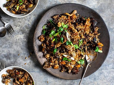 Sweet Spiced Mushroom and Rice Pilaf, in New York, on Nov. 12, 2019. To elevate rice to the center of the holiday table, Yotam Ottolenghi bakes it in fragrant stock, with mixed mushrooms. (Andrew Scrivani/The New York Times)
