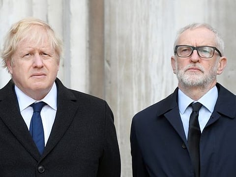 Britain's Prime Minister Boris Johnson and Britain's opposition Labour Party leader Jeremy Corbyn attend a vigil for victims of a fatal attack on London Bridge in London, Britain December 2, 2019.  REUTERS/Toby Melville
