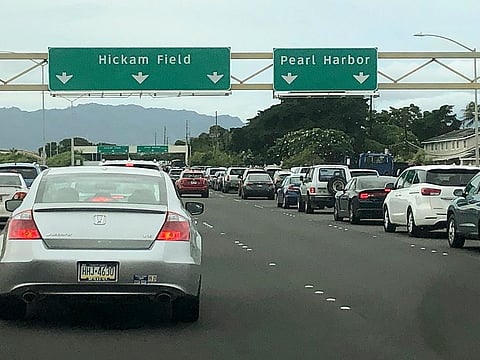 Traffic backs up at the main gates after a shooting at Pearl Harbor Naval shipyard, Wednesday, Dec. 4, 2019, near Pearl Harbor in Honolulu.