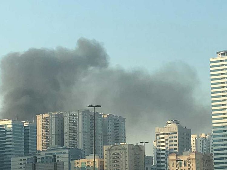 Smoke rising from a parking lot in Al Nahda