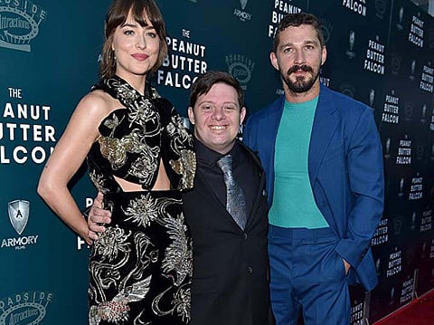 Dakota Johnson, Shia LaBeouf, and Zack Gottsagen at an event for The Peanut Butter Falcon (2019)

Titles: The Peanut But