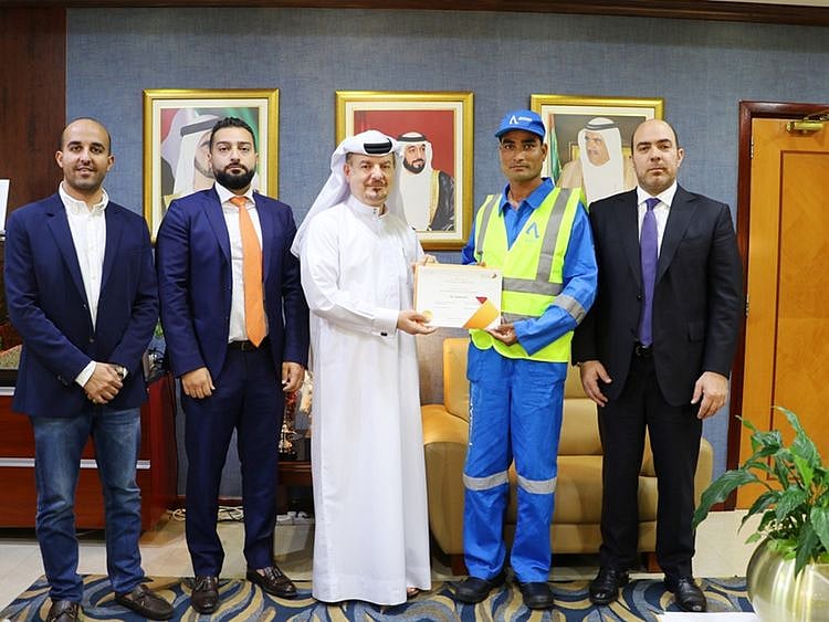 Cleaner honoured for returning lost wallet