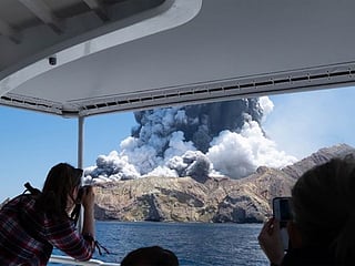 In pictures: Five dead, tourists stranded as New Zealand volcano erupts 