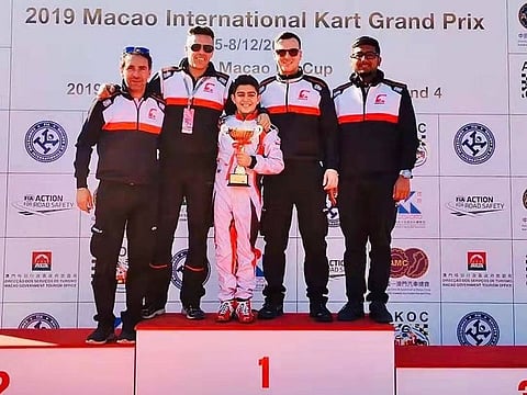 Rashid Al Dhaheri on the podium with his team.