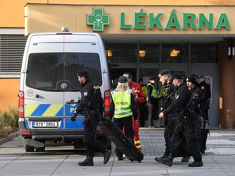 Police officers walk outside the University Hospital, which was a site of a shooting, in Ostrava, Czech Republic, December 10, 2019.