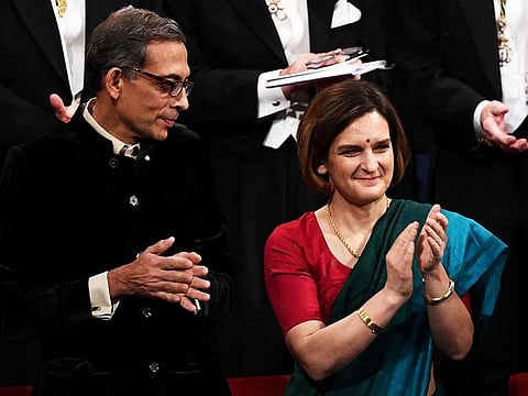 French–American economist Esther Duflo (C) and US economist Abhijit Banerjee (L) during the Nobel Prize Award ceremony on December 10, 2019 at the Concert Hall in Stockholm, Sweden.