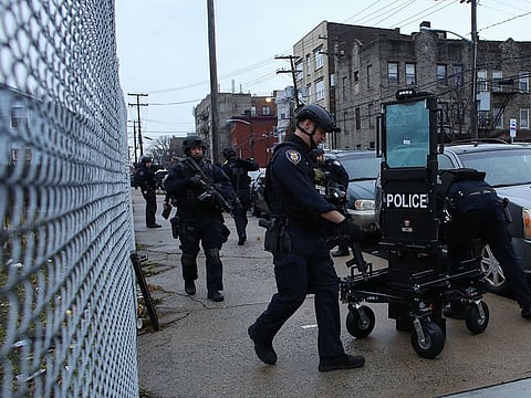 Police officers arrive to the scene where active shooting was happening in Jersey City on December 10, 2019.  