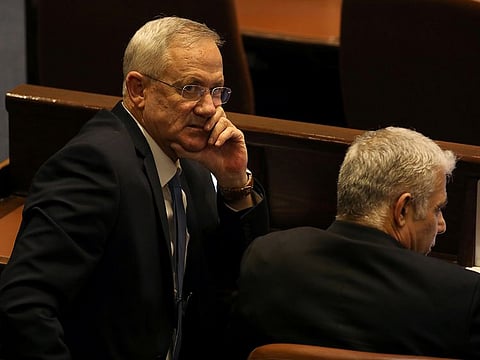 Benny Gantz, leader of Blue and White party, and Yair Lapid attend a parliamentary vote for its dissolution and approval of a date for a third national election in less than a year, at the Knesset, or Israel's parliament, in Jerusalem December 11, 2019.