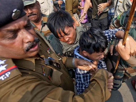 Police officers try to detain demonstrators during a protest against the Citizenship Amendment Bill,  that seeks to give citizenship to religious minorities persecuted in neighbouring Muslim countries, in Agartala, India, December 11, 2019. REUTERS/Jayanta Dey     TPX IMAGES OF THE DAY