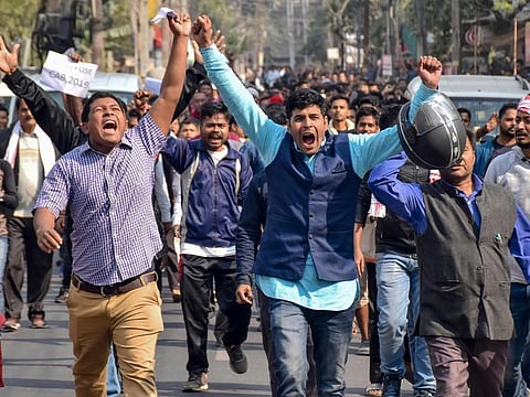 Demonstrators shout slogans during a protest against the government's Citizenship Amendment Bill (CAB) in Guwahati on December 12, 2019. Indian police fired blanks on December 12 as thousands of protesters ignored a curfew in the north-east of the country, in a fresh day of demonstrations against contentious new citizenship legislation. 