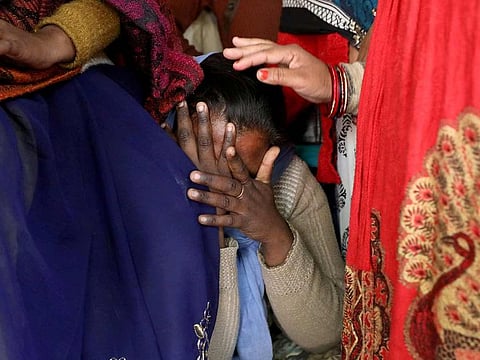 A relative of a 23-year-old rape victim, who died in a New Delhi hospital on Friday after she was set on fire by a gang of men, which included her alleged rapists, is consoled as she mourns the death of the victim outside a house in Unnao, in the northern state of Uttar Pradesh, India December 7, 2019.