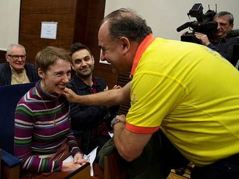British Audrey Mash and her husband Rohan Schoeman speak with medical staff at Vall d'Hebron hospital in Barcelona, Spain, December 5, 2019. Picture taken December 5, 2019. REUTERS/Stringer       NO RESALES. NO ARCHIVES.