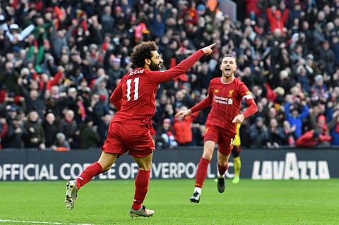 Liverpool's Egyptian striker Mohammed Salah (No.11) celebrates scoring his team's first goal during their Premier League clash against Watford at Anfield today.