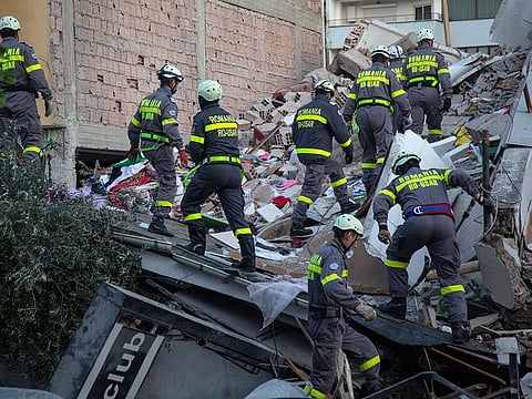 Rescuers from Romania operate at a collapsed building after the 6.4-magnitude earthquake in Durres, western Albania in November