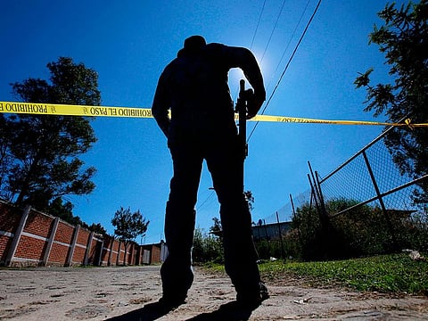 A staff member of the Specialized Prosecutor's Office for Missing Persons works at El Mirador neighborhood, in Tlajomulco de Zuniga, state of Jalisco, Mexico, on November 22, 2019.  