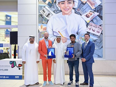Issam Galadari(center), CEO, The Waterfront Market, along with Mohammed Almadani(left),Centre Manager, The Waterfront Market, and Lachlan Gyde(right), Executive Director, Retail, Resident & Commercial, ITHRA Dubai,pose with the winners, Artist John Paul Atillianno Faderogao(2nd from right) and Artists Spencer James Hogg, during an event to view the winners art for the Waterfront Market 2019 Murals & Art competition in collaboration with Dubai Culture and Art Authority at The Waterfront Market Dubai. 15th December 2019. Photo: Ahmed Ramzan/ Gulf News