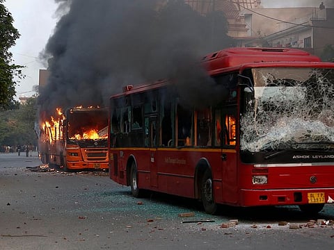 Passenger buses go up in flames during a protest against Citizenship Amendment Act in New Delhi