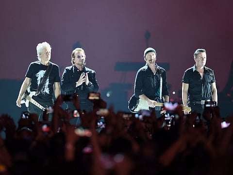 Irish rock band U2 perform during a concert at the D.Y. Patil stadium in Navi Mumbai on December 15, 2019.