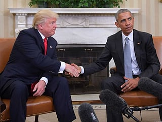 In this file photo taken on November 10, 2016, US President Barack Obama and President-elect Donald Trump shake hands during a  transition planning meeting in the Oval Office at the White House in Washington, DC.