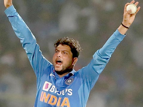 India's Kuldeep Yadav celebrates the hat-trick during the second one day international (ODI) cricket against the West Indies in Visakhapatnam on December 18, 2019.  