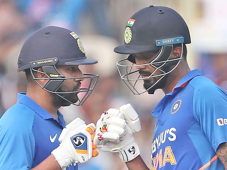 Rohit Sharma, left, interacts with batting partner KL Rahul