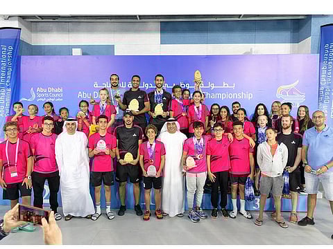 Participants pose at the Abu Dhabi International Swimming Championship.