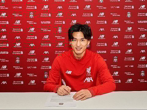 Takumi Minamino signs on at Liverpool.