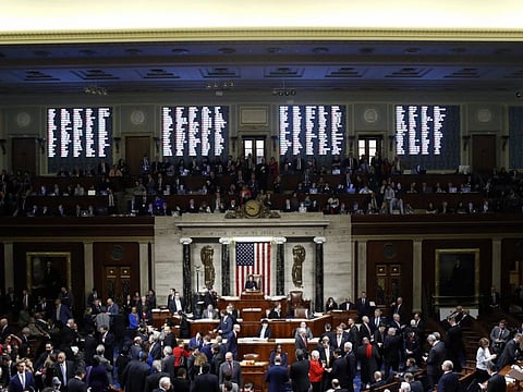 US House Speaker Nancy Pelosi stands on the dais as House members vote on impeachment against President Donald Trump in the House Chamber in Washington, D.C., U.S., on  December 18, 2019. The US House of Representatives impeached Trump on charges of abuse of power and obstructing Congress