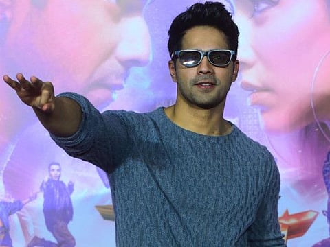 Bollywood actor Varun Dhawan poses for photographs during the trailer launch of the upcoming Hindi dance film "Street Dancer 3D" in Mumbai on December 18, 2019.  / AFP / Sujit Jaiswal