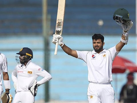 Pakistani batsman Azhar Ali acknowledges his 100 against Sri Lanka.