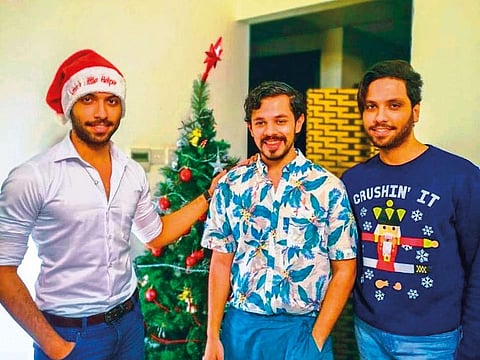 Ahmad Emad with his brother and a friend. The 24-year-old artist’s family gathers at his house on December 25 to enjoy a feast prepared by his mother. They also put up a Christmas tree.