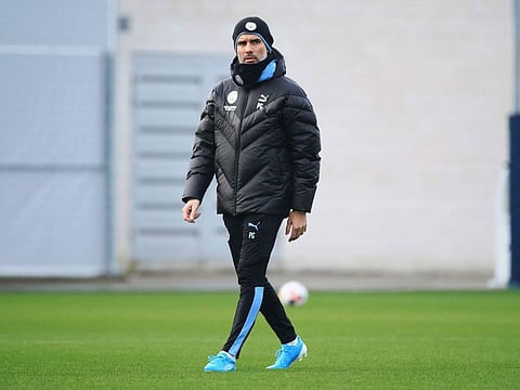Pep Guardiola oversees Manchester City training.