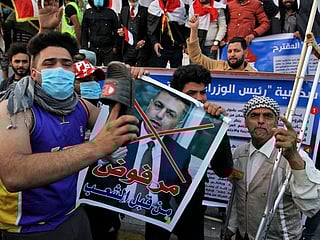 Iraqis split on president’s threat to quit