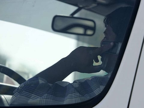 A man talks on the mobile phone while driving 
Gulf News archives