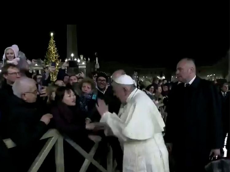 Pope slaps devotee