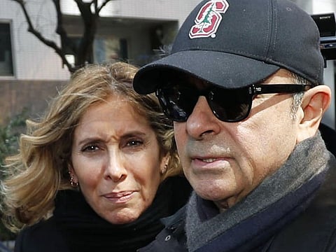 This March, 2019, file photo shows former Nissan Chairman Carlos Ghosn, right, and his wife Carole in Tokyo. 