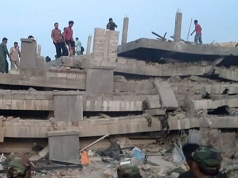 Rescuers look for trapped workers after a seven-storey building under construction collapsed in southern Cambodia's coastal Kep province on January 3, 2020.