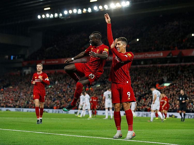 Sadio Mane and Roberto Firmino celebrate the win over Sheffield.