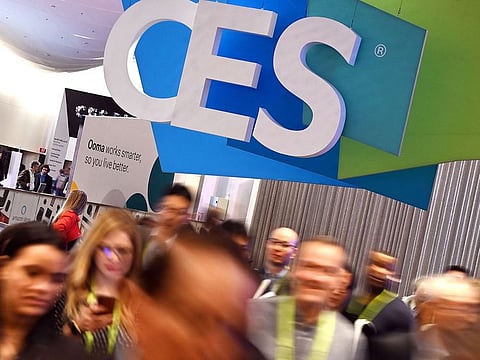 In this file photo taken on January 10, 2019, attendees walk through the hall at the Sands Expo Convention Center during CES 2019 consumer electronics show in Las Vegas, Nevada. 