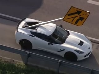 Chevrolet Corvette impaled after five-vehicle crash sends road sign soaring through air and into back of sportscar