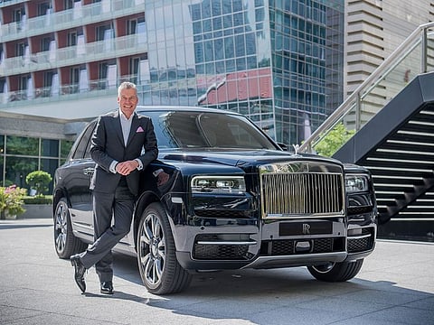 Rolls-Royce’s CEO, Torsten Muller-Otvos with the brands new and very popular Cullinan SUV.