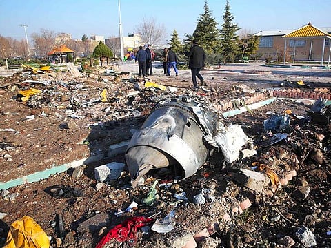 Rescue teams work amidst debris after a Ukrainian plane carrying 176 passengers was shot down near Imam Khomeini airport in  Tehran.