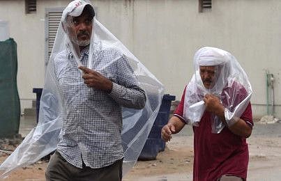 People covering their self from rain in Ajman on 10 JAN 2020  photo; Atiq Ur Rehman /Gulf News