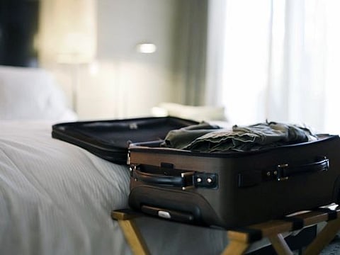 Dangers of putting a suitcase on the bed