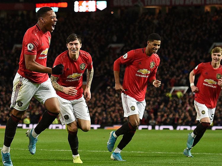 Manchester United's Anthony Martial celebrates scoring their third goal against Norwich City.